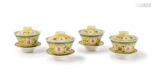 SET OF FOUR YELLOW GROUND FAMILLE ROSE TEA CUPS