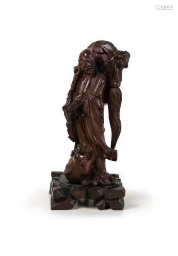 CARVED WOOD FIGURE OF 