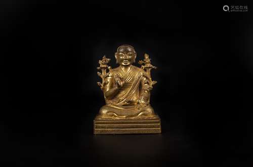 A GILT-GOLD FIGURE OF JE TSONKHAPA