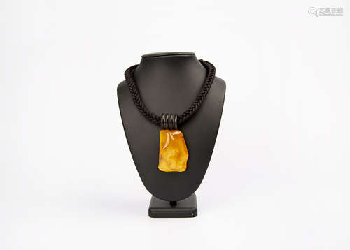 AN AMBER PENDANT