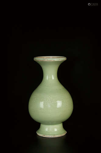 A CHINESE CARVED CELADON VASE