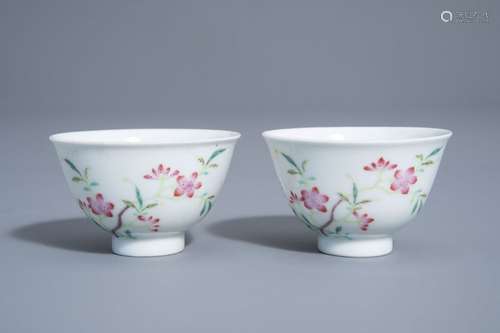 A pair of Chinese famille rose cups with floral de...