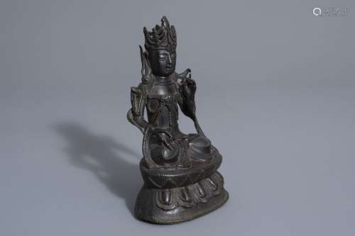 A Sino Tibetan bronze figure of Buddha, Ming