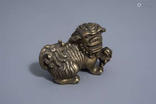 A Chinese bronze model of a Buddhist lion, late Qi...