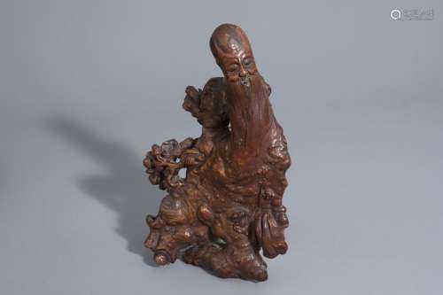 A Chinese carved root wood figure of Shou Lao, 19t...