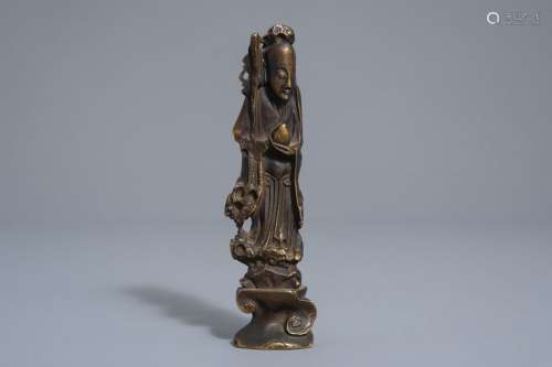A Chinese bronze scroll weight modelled as the fig...