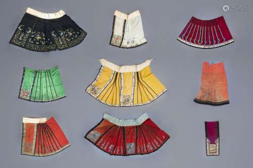 A collection of Chinese embroidered silk girls' sk...