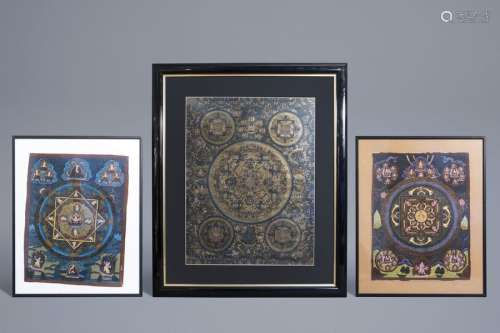 Three framed thangkas with different designs, Tibe...