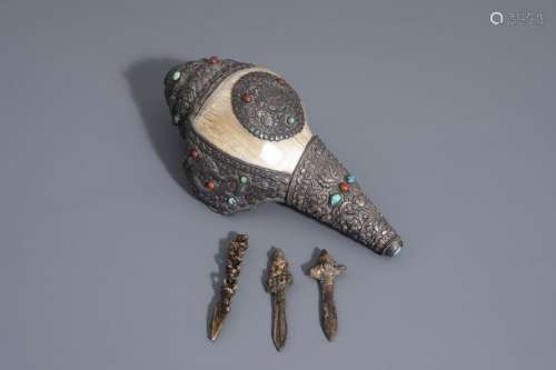 A Tibetan silver mounted conch shell horn and thre...