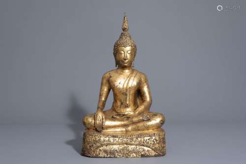 A gilt bronze figure of a seated Buddha, Thailand ...
