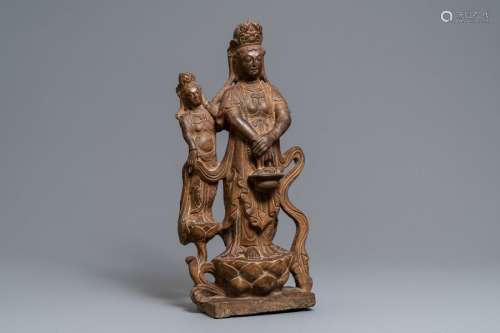 A Chinese carved stone 'Guanyin and attendant' gro...