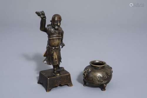 A Chinese bronze incense stick holder and a censer...