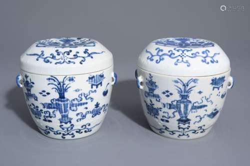 A pair of Chinese blue and white covered bowls wit...
