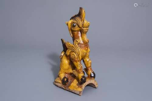 A Chinese glazed roof tile shaped as a mythical an...