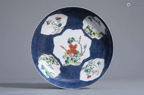 A Chinese famille verte powder blue ground dish wi...