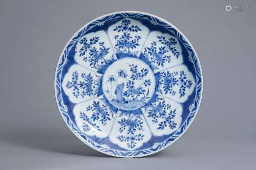 A Chinese blue and white charger with floral desig...