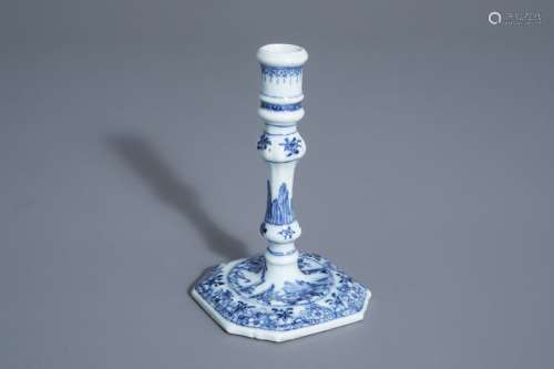 A Chinese blue and white candlestick with a landsc...