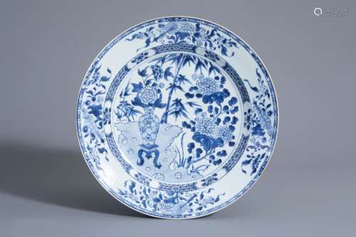 A Chinese blue and white charger with floral desig...