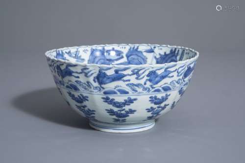 A Chinese blue and white bowl with flying horses a...