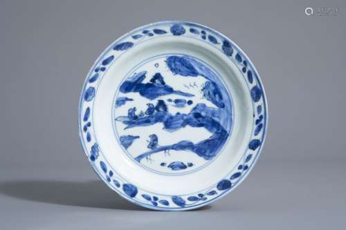 A Chinese blue and white dish with figures in a la...
