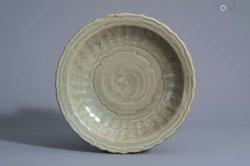 A Chinese Longquan celadon dish with incised flora...