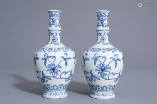 A pair of Chinese blue and white vases with floral...