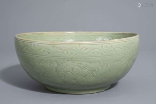 A Chinese Longquan celadon bowl with incised flora...