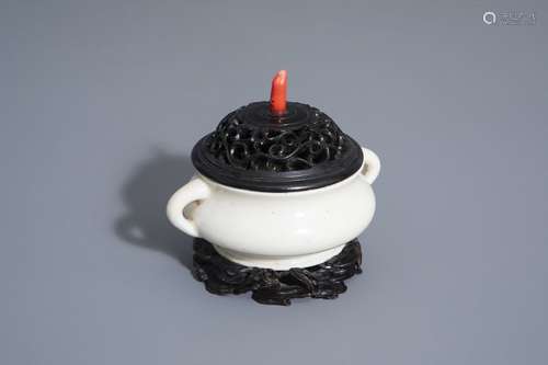 A Chinese blanc de Chine incense burner with woode...