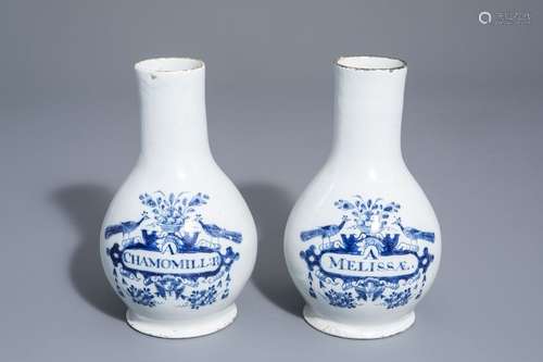 A pair of Dutch Delft blue and white pharmacy bott...