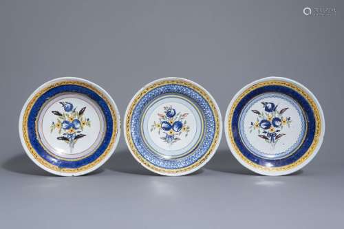 Three polychrome Brussels faience plates with flow...