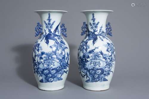 A pair of Chinese blue and white vases with a bird...
