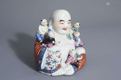A Chinese famille rose figure of Buddha with child...