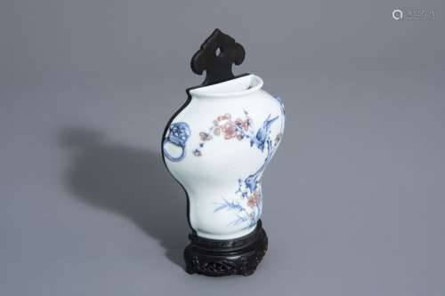 A Chinese blue, white and copper red wall vase wit...