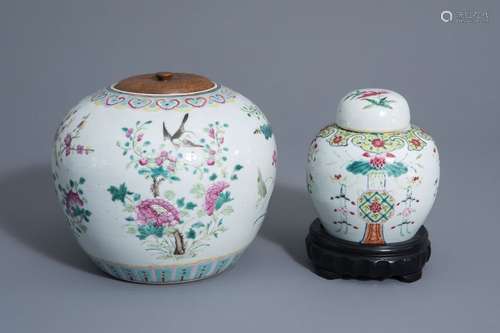 Two Chinese famille rose jars and covers with flor...