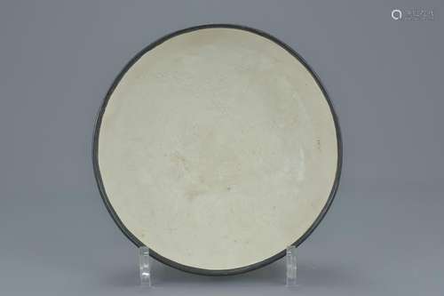 A Chinese Song dynasty (960-1279) white glazed Ding