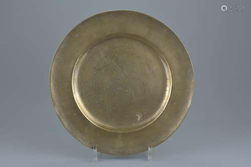 A Chinese polished bronze dish with incised work