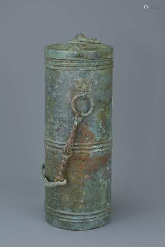 A Chinese Han dynasty bronze wine vessel with a bronze