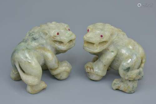 A pair of 19th century carved jadeite lions possibly