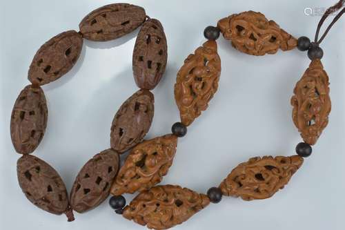 Two Chinese carved nut beads in bracelets. One carved