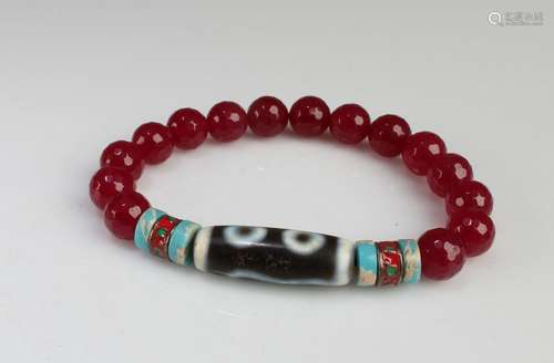 A Beaded Bracelet with a Dzi Bead