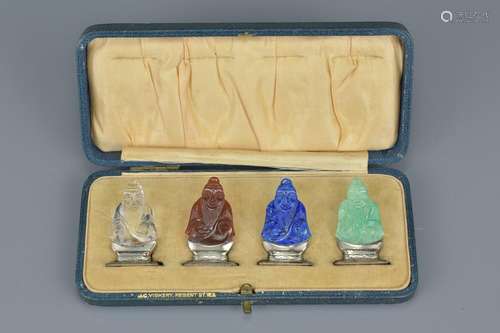 A set of four early 20th century coloured stone and