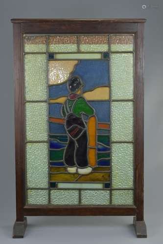 An English 19/20th century stained glass fire screen in