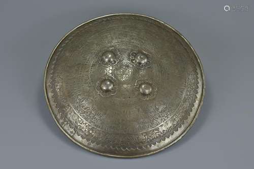 A large Middle Eastern metal shield of circular convex