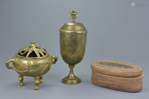 A Chinese polished bronzeÂ tripodÂ censer with