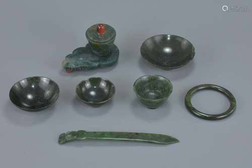 A group of seven Chinese jade items including a pot and