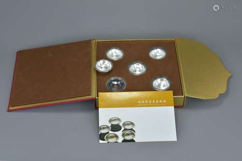 A Chinese boxed set of five 999 silver bowls each