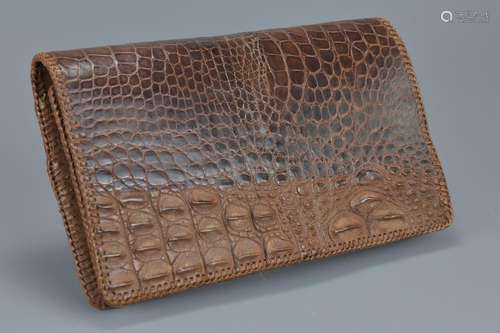 A vintage crocodile leather clutch bag in very good