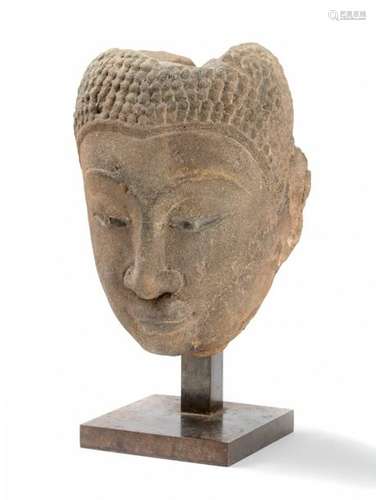 Sandstone Buddha head sketching a slight smile, \n …