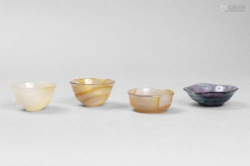 Set of medicine cups \n \nAgate resting on a narrow …