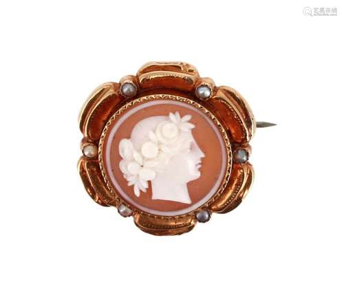 Brooch set with a round shell cameo with the profi…